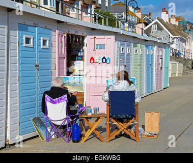 Artists painting pictures on the promenade, Lyme Regis, Dorset, England UK Stock Photo