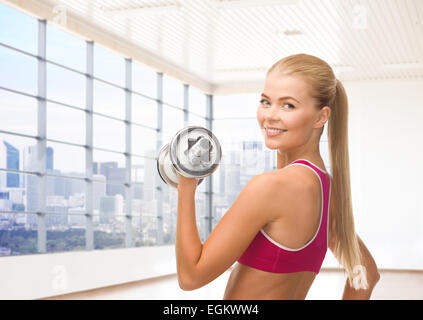 close up of sporty woman flexing her bicep Stock Photo