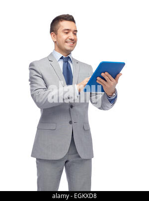 happy businessman in suit holding tablet pc Stock Photo