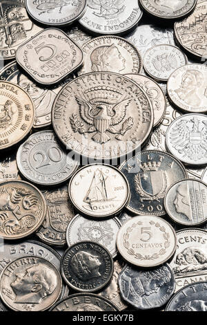 A collection of old silver coins from around the world Stock Photo