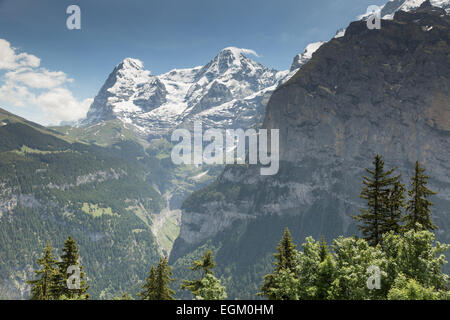 A view of Swiss Alp mountains looking east across Lauterbrunnen valley from hiking trail near Murren, Switzerland. Stock Photo