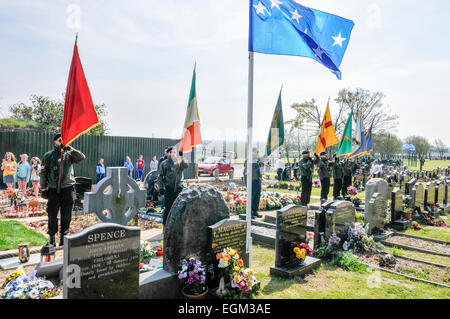 Irish Republican Socialist Party (IRSP) members in paramilitary uniforms carry Irish republican flags during an Easter Rising commemoration remembering Irish National Liberation Army (INLA) volunteers, Belfast, Northern Ireland Stock Photo