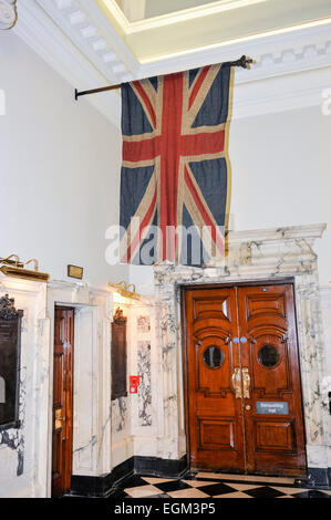 An old Union Flag hangs inside City Hall, Belfast Stock Photo