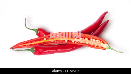 Two whole and one half red chili peppers isolated on white background Stock Photo