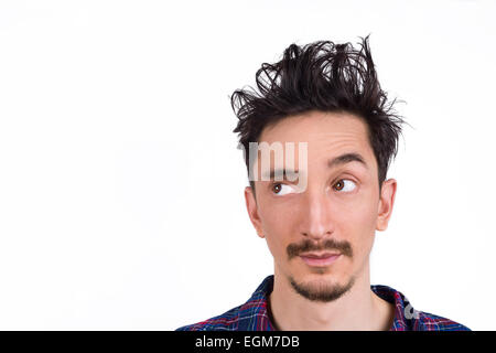 Portrait of a man in pajamas and bed hair looking to the left. isolated on white. Stock Photo