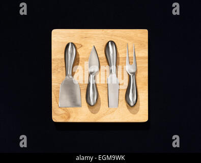 Cutting Board With Cheese Utensils Stock Photo