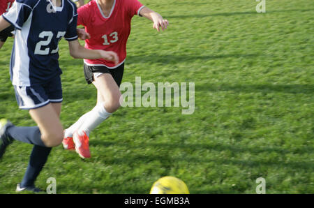 Two Young Girls Playing Soccer Stock Photo