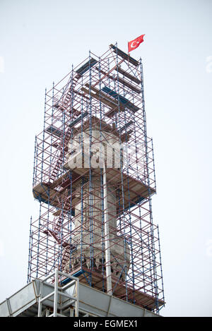 ISTANBUL, Turkey / Türkiye — Scaffolding surrounds one of the six minarets of the Blue Mosque for repairs. While it is widely known as the Blue Mosque for the its interior tiling, the mosque's formal name is Sultan Ahmed Mosque (or Sultan Ahmet Camii in Turkish). It was built from 1609 to 1616 during the rule of Sultan Ahmed I. Stock Photo