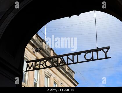 Merchant city sign in archway silhouetted against blue sky in Glasgow, Scotland, UK Stock Photo