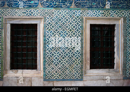 ISTANBUL, Turkey / Türkiye — The corridor outside the main entrance of the Harem, separating the living quarters of the family, concubines, and Sultan from the Harem Eunuchs. The door leads out into the Nobet Yeri, the sentry post, which is connected to the three main sections of the Harem. The Imperial Harem was the inner sanctum of the Topkapi Palace where the Sultan and his family lived. Standing on a peninsular overlooking the Bosphorus Strait and Golden Horn, Topkapi Palace was the primary residence of the Ottoman sultans for approximately 400 years (1465–1856) of their 624-year reign. Stock Photo