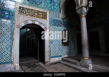 ISTANBUL, Turkey / Türkiye — The corridor outside the main entrance of the Harem, separating the living quarters of the family, concubines, and Sultan from the Harem Eunuchs. The door leads out into the Nobet Yeri, the sentry post, which is connected to the three main sections of the Harem. The Imperial Harem was the inner sanctum of the Topkapi Palace where the Sultan and his family lived. Standing on a peninsular overlooking the Bosphorus Strait and Golden Horn, Topkapi Palace was the primary residence of the Ottoman sultans for approximately 400 years (1465–1856) of their 624-year reign. Stock Photo