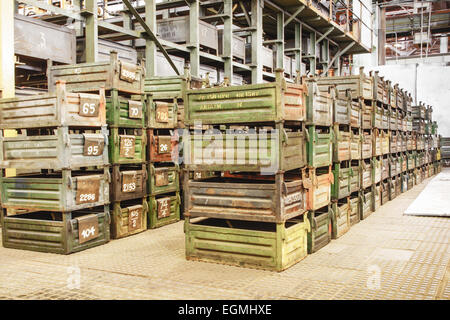 Big storage room with metal boxes in factory Stock Photo