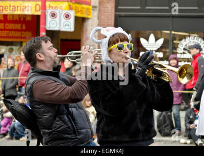 Two trumpet players from The Carnival Band of Vancouver, in the Chinese New Year's parade, welcoming year of the sheep. Stock Photo