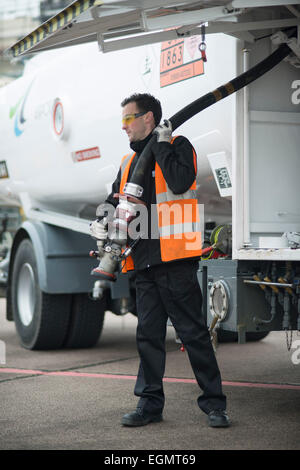 airport worker behind the scenes at Shoreham (Brighton City) Airport, firefighters, airport staff, planes, refueling planes etc. Stock Photo