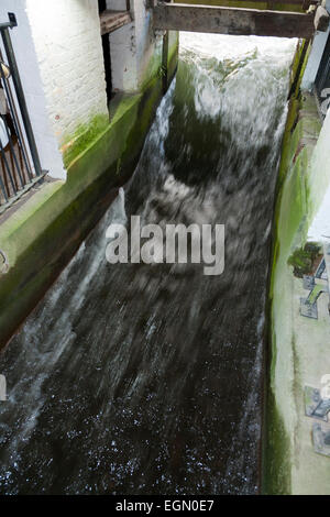 Moving water flowing around, into, through the Winchester mill; being used to drive operate the water wheel. Winchester Mill, UK Stock Photo