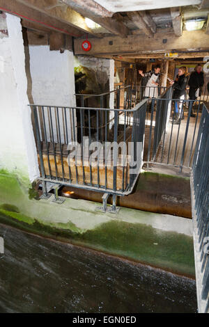 Moving water flowing around, into, through the Winchester mill; being used to drive operate the water wheel. Winchester Mill, UK Stock Photo