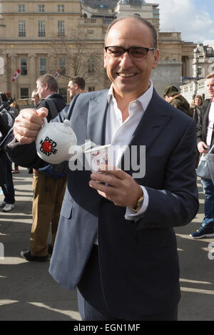 London, UK. 27 February 2015. Pictured: Theo Paphitis. Theo Paphitis and his celebrity friends Paul Bradley, Matt Cardle, Helen Lederer, Nick Moran, Lauren Goodger and Jake Wood had a brew with a gigantic 8ft 4” teapot for charity in Trafalgar Square today, before handing out tea to passers-by. 'Tea with Theo' raises money for Comic Relief in the run-up to Red Nose Day on the BBC, on Friday 13th March. Credit:  Nick Savage/Alamy Live News Stock Photo