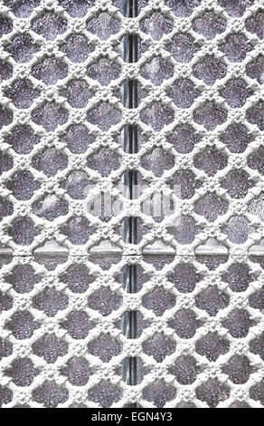 Old metal gate decorated, detail of an old fence painted white, protection and decoration Stock Photo