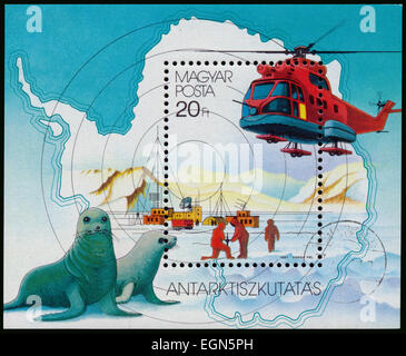 HUNGARY - CIRCA 1987: Stamp printed by Hungary, shows helicopter and seals, discovering South Pole, circa 1987 Stock Photo