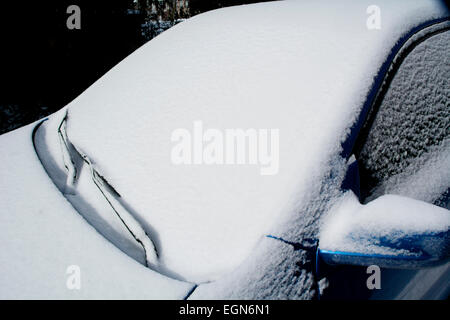 Fresh layer of snow on a car windshield Stock Photo