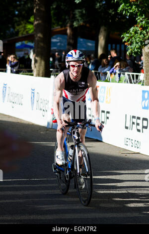 COEUR D ALENE, ID -  JUNE 23: Triathlete on the bike part of the ironman triathlon, June 23 2013 in Coeur d' Alene Idaho Stock Photo