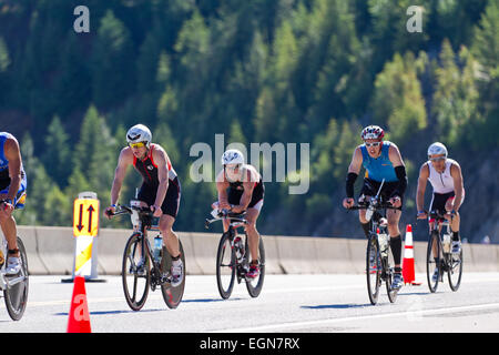 COEUR D ALENE, ID -  JUNE 23: Triathlete on the bike part of the ironman triathlon, June 23 2013 in Coeur d' Alene Idaho Stock Photo