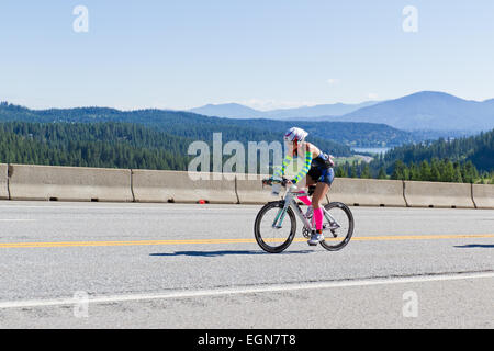 COEUR D ALENE, ID -  JUNE 23: Triathlete on the bike part of the ironman triathlon, June 23 2013 in Coeur d' Alene Idaho Stock Photo