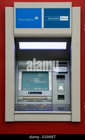 Riga Latvia. ATM cash dispenser automated teller machine cashpoint cashline on shopping street. Nordea Danske Bank Stock Photo