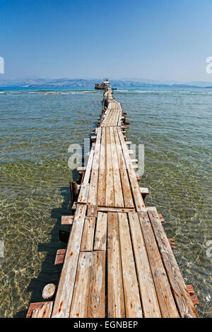 A long platform over the shallow water of Kalamaki at Corfu, Greece Stock Photo