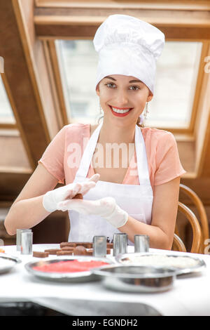 Woman making handmade candy Stock Photo