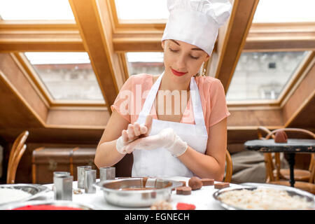 Woman making handmade candy Stock Photo