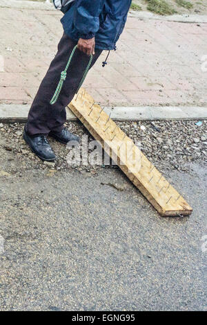 Ocosingo Chiapas, Mexico. 27th February, 2015. Cheerful band of young Zapatistas set up a wood board with nails facing up to halt traffic in both directions & politely board buses to ask for donations to their cause or ask motorists directly. Then the nails are briefly withdrawn to permit vehicle to pass. Apart from the nails, no threats are made Credit:  Dorothy Alexander/Alamy Live News Stock Photo