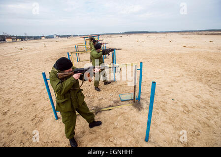 Cadets shooting from Kalashnikov guns during firing training with SPG ...