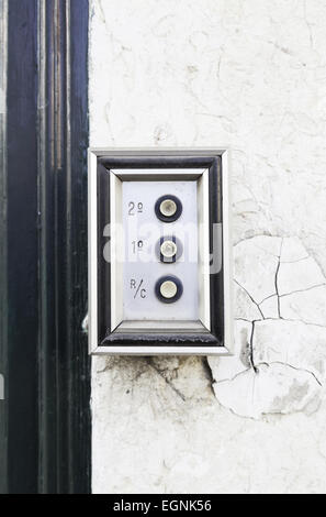Old intercom on a street in Lisbon, detail of a home electric appliance Stock Photo