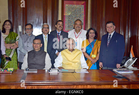 New Delhi, India. 27th Feb, 2015. Indian Finance Minister Arun Jaitley (R, front) and member of Indian Standing Committee on Finance Jayant Sinha (L, front) pose for photos with their team members on the eve of an annual budget presentation in New Delhi, India, Feb. 27, 2015. Indian government Friday presented a rosy picture of economic perspective in the coming fiscal year which starts in April, saying the country's GDP growth could surpass eight percent in the fiscal year. Credit:  Partha Sarkar/Xinhua/Alamy Live News Stock Photo