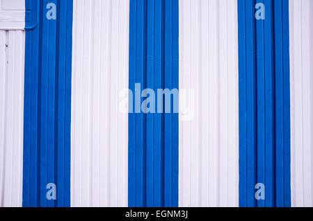 A corrugated metal door painted in Mediterranean colors Stock Photo