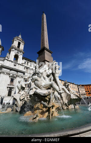 Bernini's Fountain of the Four Rivers (Fontana dei Quattro Fiumi) standing in Piazza Navona in Rome. Stock Photo