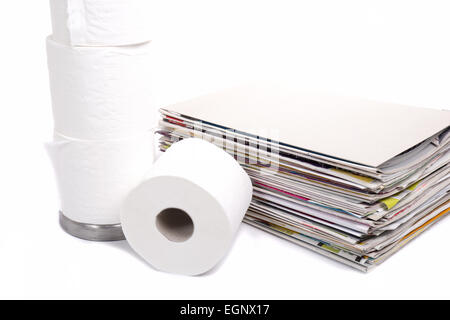 toilet paper and stack of magazines on white background Stock Photo