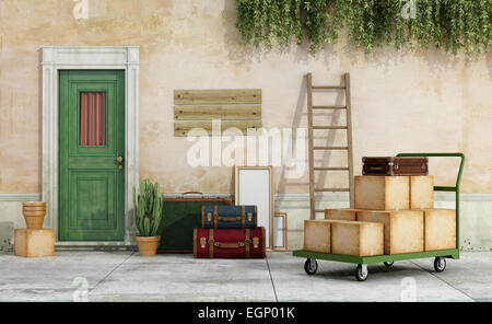 Exterior of an old house, with  cart full of boxes, suitcases, ready for the move - 3D Rendering Stock Photo