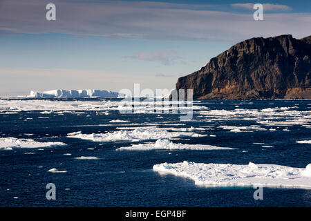 Antarctica, Weddell Sea, floating pack ice off rocky headland Stock Photo
