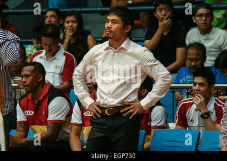 San Juan, Metro Manila, Philippines. 28th February, 2015. Team Kia coach Manny Pacquiao looks on while his team is playing. Manny Pacquiao lead his team for the last time before going on to trainning against his fight against Floyd Mayweather on May 2, 2015. His team Kia Sorrento lost, 104 to team Blackwater Elite's score of 115. Credit:  J Gerard Seguia/Pacific Press/Alamy Live News Stock Photo