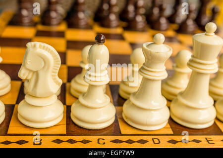 Chess board with starting positions aligned chess pieces Stock Photo