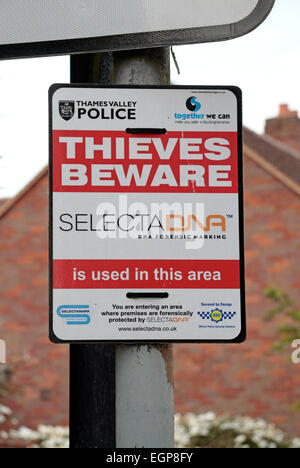 A Police warning (to thieves) sign on a lamp post in Wendover, Buckinghamshire, England. Stock Photo