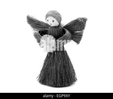 Christmas Angel tree decoration made from straw, isolated on a white background - monochrome processing Stock Photo