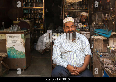 Muslim shopkeeper at a Market stall in Bhendi Bazaar, Mumbai, India Stock Photo