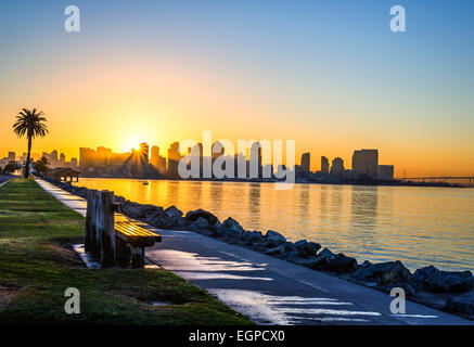 The Sun rising over the Downtown Skyline viewed from Harbor Island. San Diego, California, United States. Stock Photo