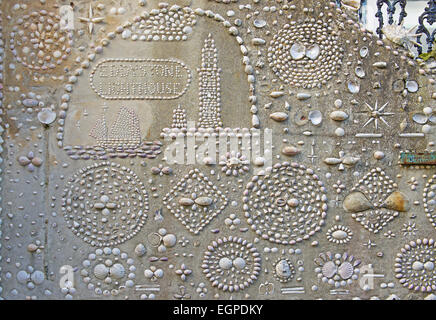 Wall of house decorated with sea-shells, Polperro, Cornwall, England UK Stock Photo