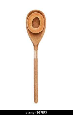 wooden spoon with a bagel isolated on white background Stock Photo