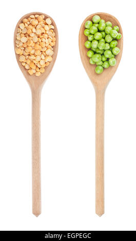 Green peas, dried peas in a wooden spoon, isolated on white Stock Photo