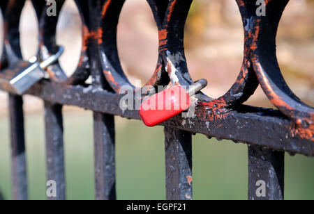 many locks on the metal fence Stock Photo
